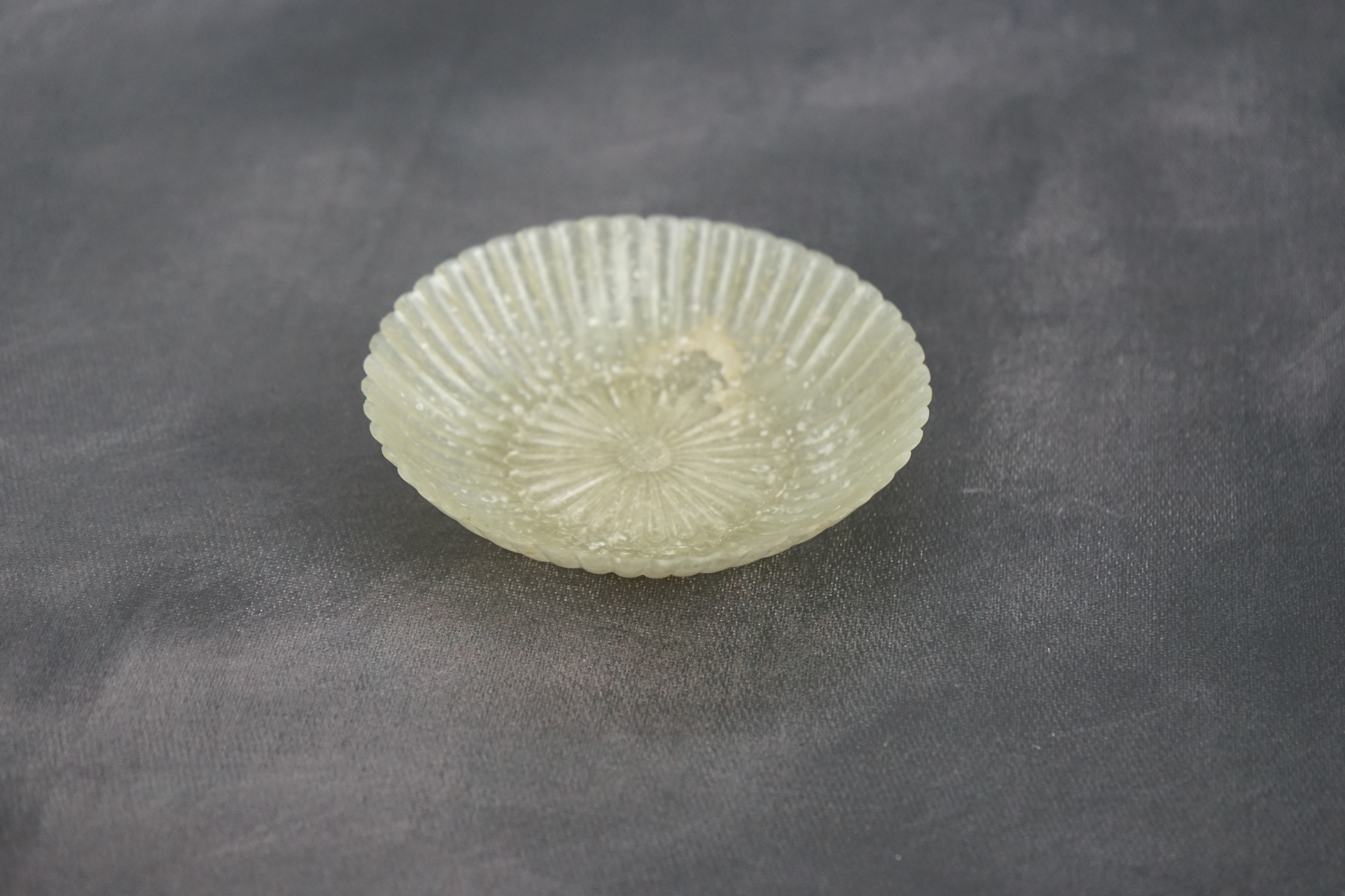 A Chinese pale celadon jade ‘chrysanthemum’ dish, Mughal style, 18th century